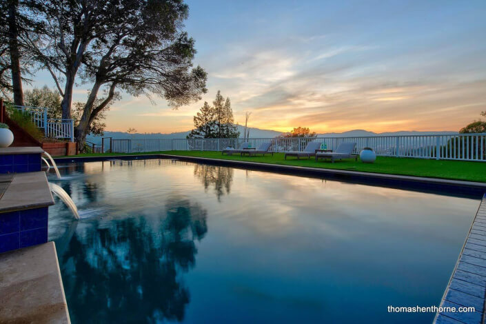 Sunset reflections on swimming pool