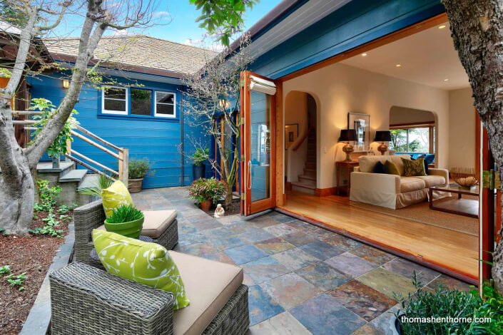 Home with wall of stacking doors open