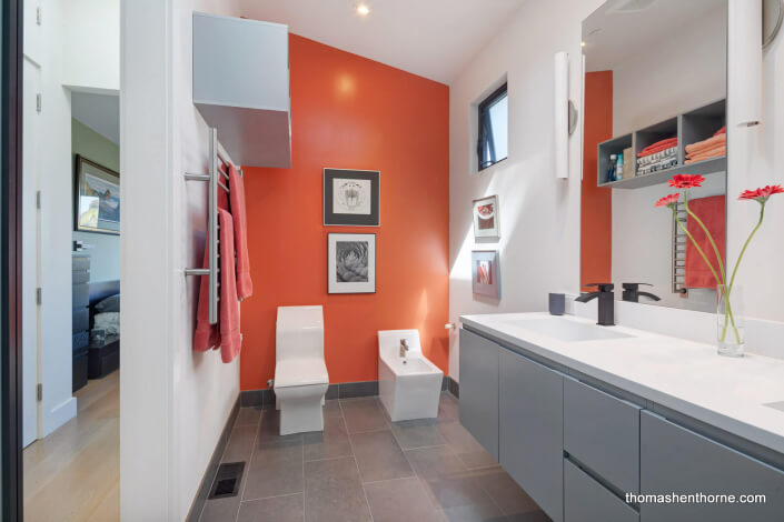 Modern bathroom with orange wall