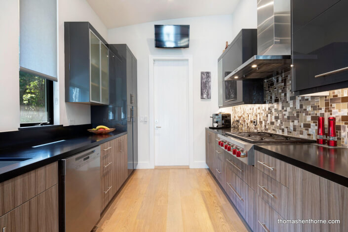 modern kitchen with glass tile backsplash