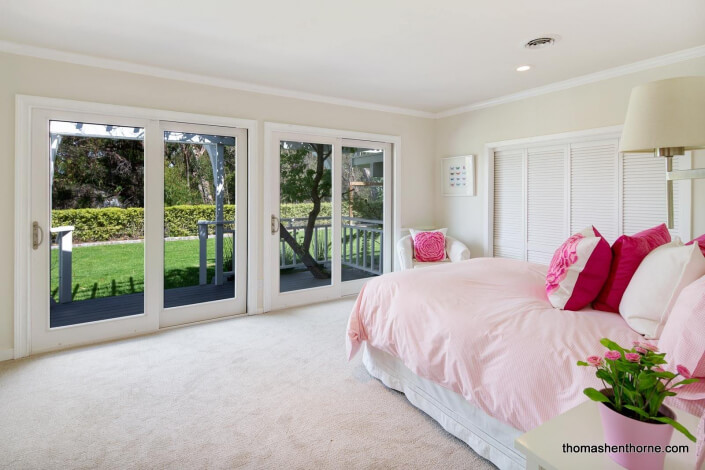 Bedroom with sliding doors outside