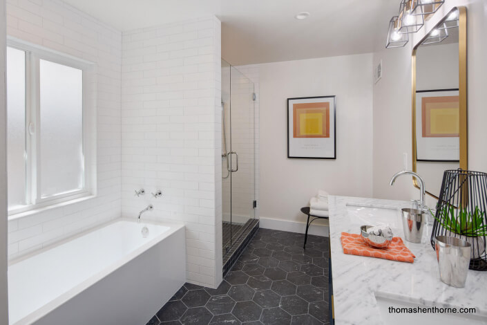 bathroom with bathtub and tile floor