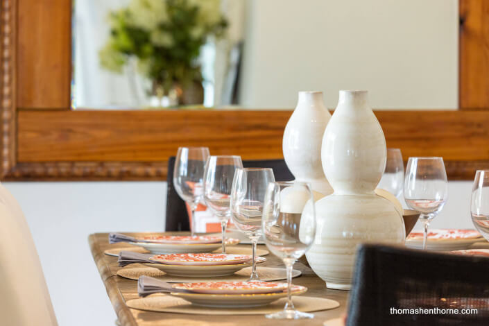 Close up of wine glasses and table settings on dining table