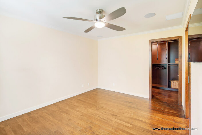 View of walk in closet from bedroom