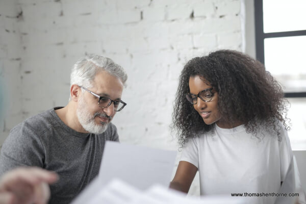 Man and woman evaluating an offer