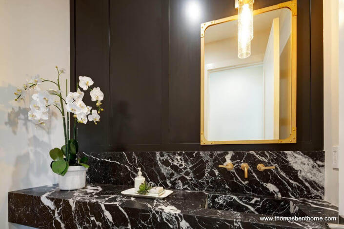 powder room with marble counter