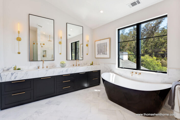 Luxury bathroom with marble countertops and soaking tub