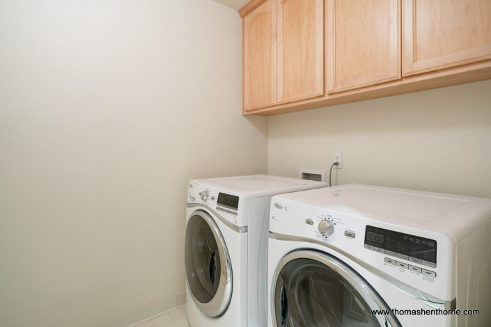 laundry room with front load washer and dryer