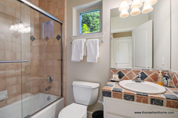 Bathroom with tub shower combination sink and toilet