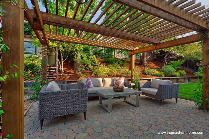 outdoor seating area with sofa and chairs