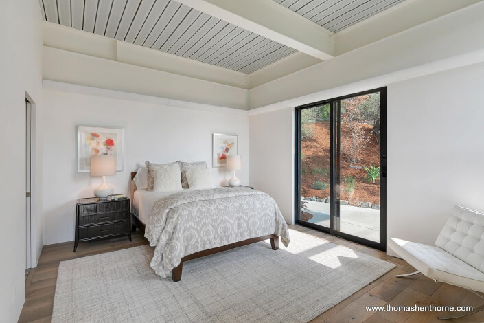 bedroom with sliding doors outside