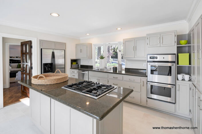 Kitchen with stainless appliances and tile floor