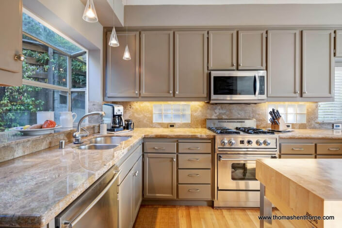 Kitchen with Stainless Appliances and Stone Countertops