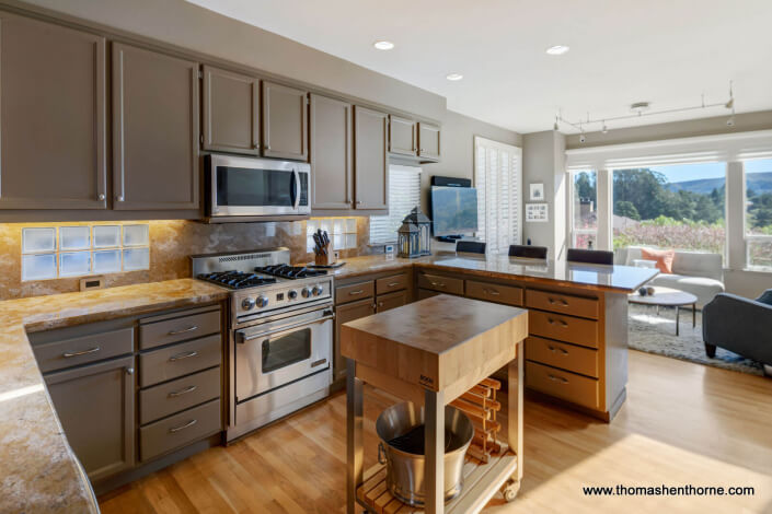 Kitchen with Stainless Appliances and Stone Countertops