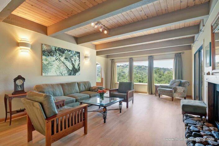 living room with beamed ceiling