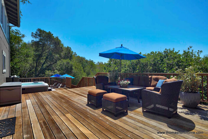 outdoor sofa with blue umbrella