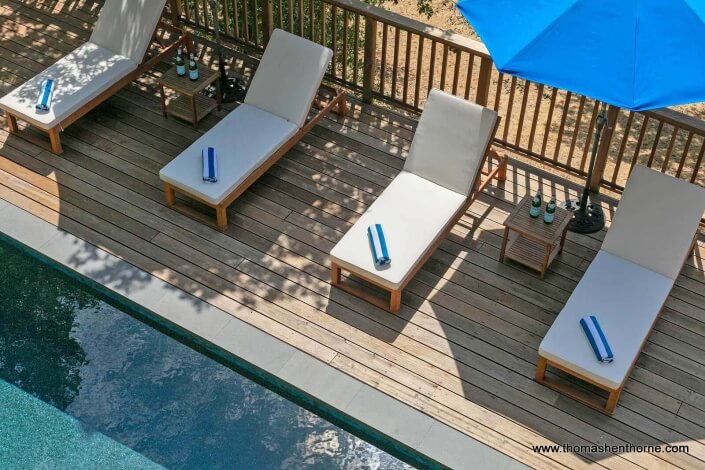 swimming pool with chaise lounges