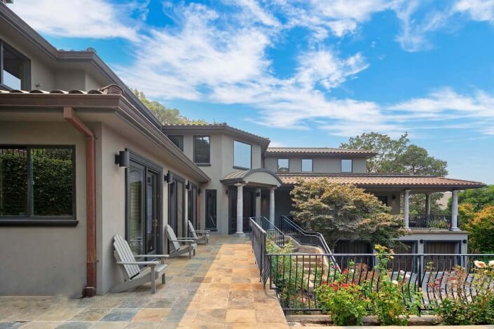 home with front decks made of stone