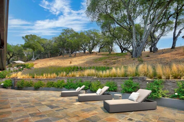 patio with three chaise lounges