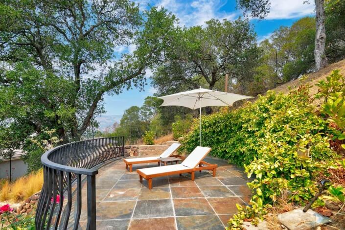 patio with two chaise lounges