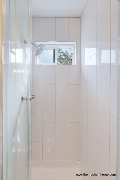 shower with white tile