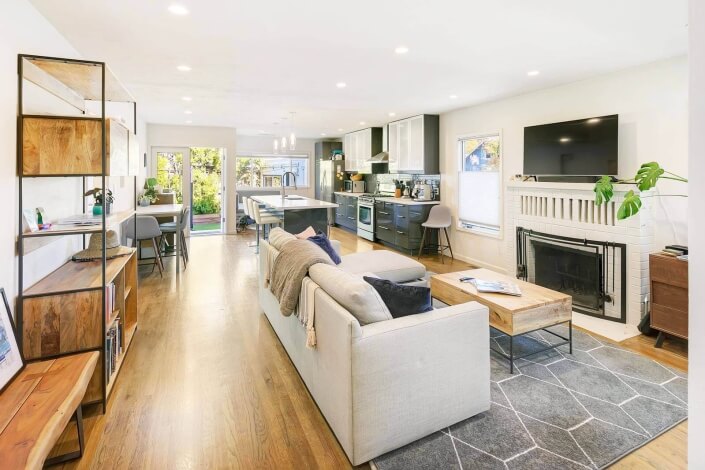 living room with fireplace looking towards kitchen andbackyard