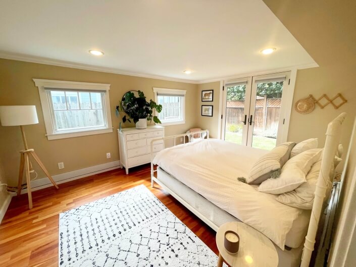 bonus room bedroom with french doors outside