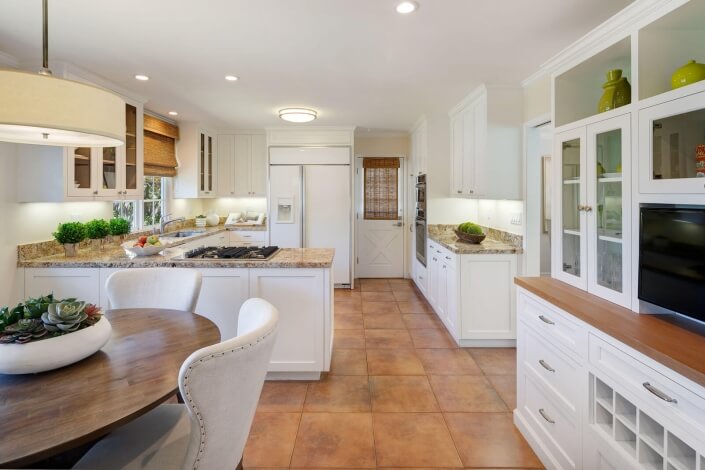 kitchen with stone countertops and tile floor