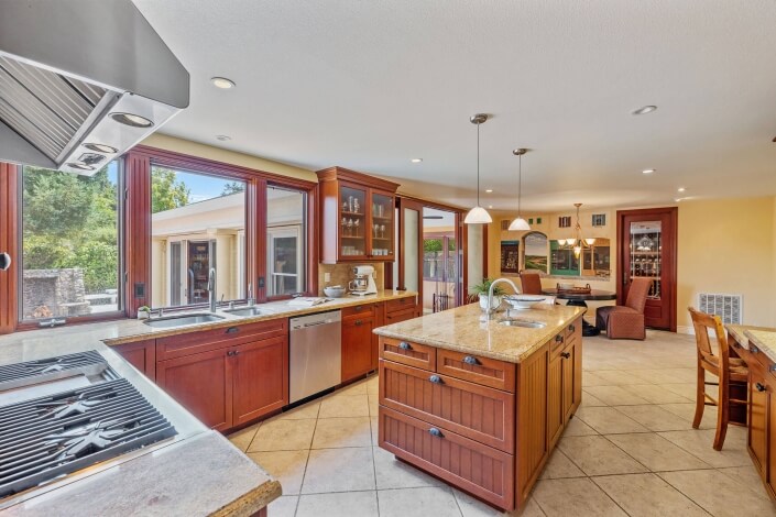 large kitchen with stone countertops