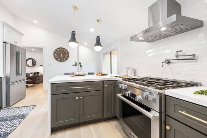Kitchen with stainless appliances and two pendant lights