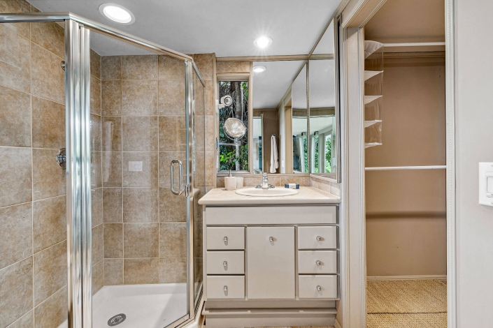Primary bathroom with glass enclosed shower