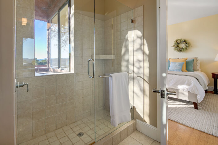 Tile walk in shower with glass door