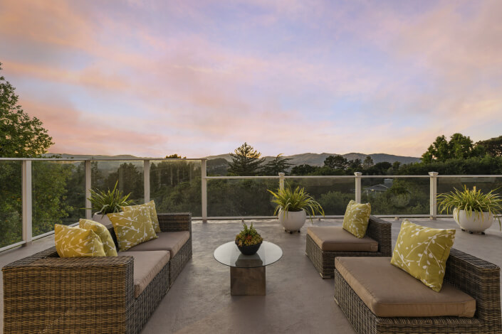 Outdoor furniture on deck at dusk