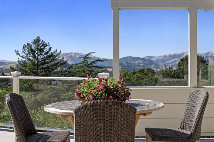 Table with flowers and view of hills