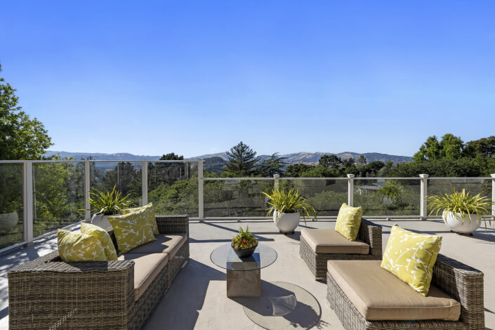 Outdoor large deck with sitting area and glass rails