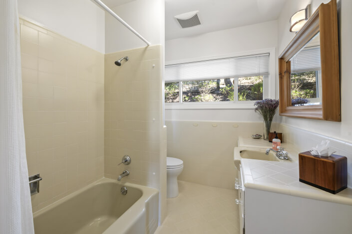 Bathroom with tiled shower tub combo