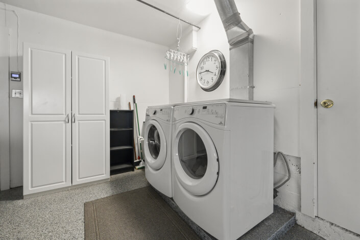 White washer and dryer with clock