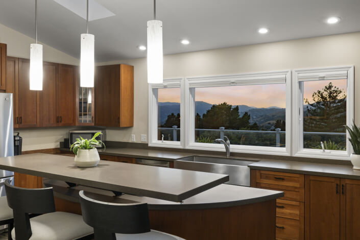 Kitchen with stainless appliances and bar