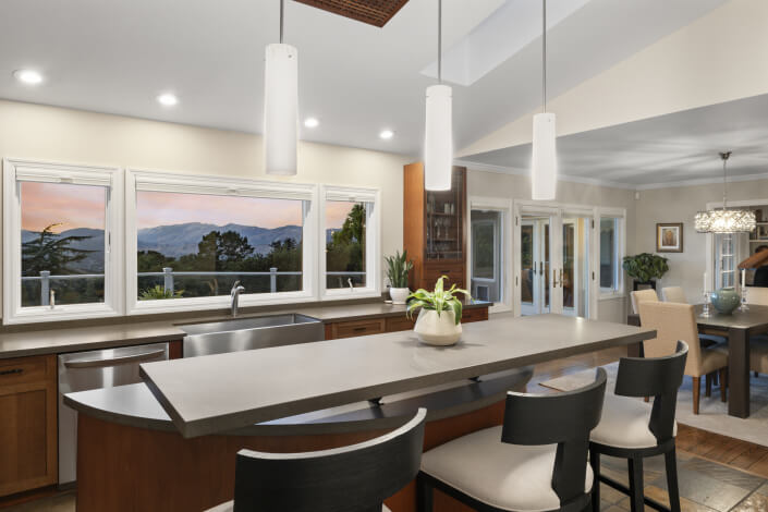 Kitchen with stainless appliances and bar