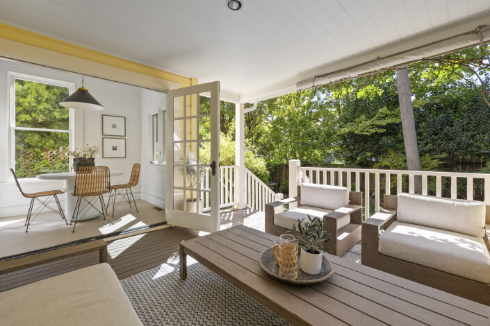 Back porch with seating opening up to the kitchen