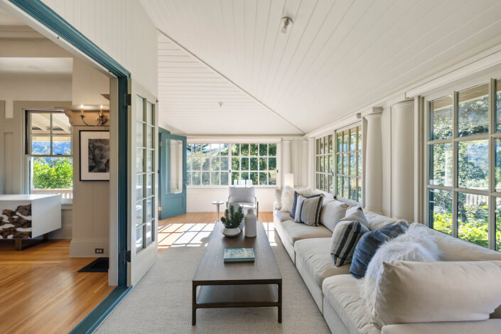 Sunroom with long sofa and table