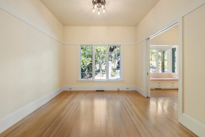 Room with hardwood floors and yellow walls